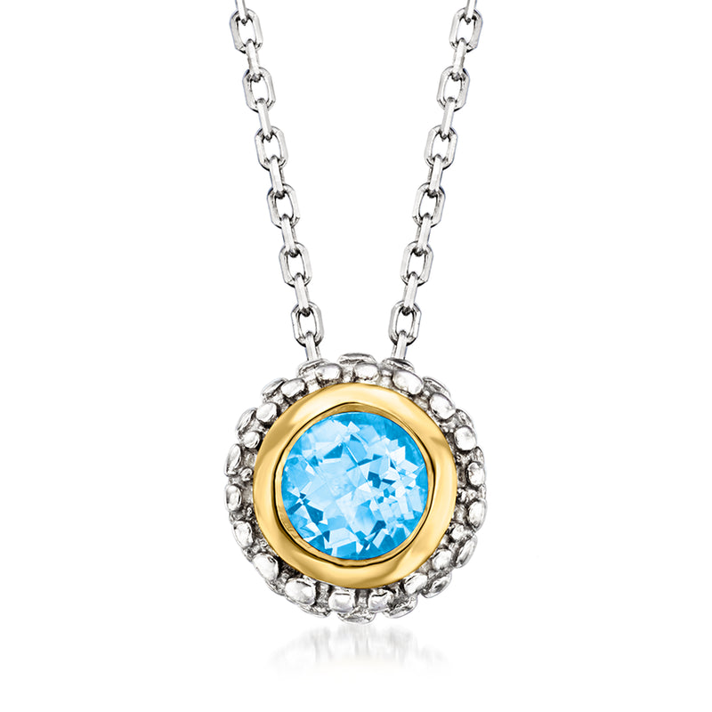 Sterling silver pendant necklace with round blue topaz in yellow gold bezel