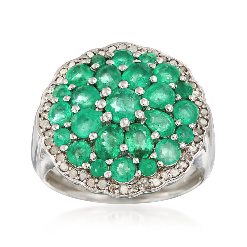 Sterling silver cluster ring with oval emerald center and round green stones, halo border