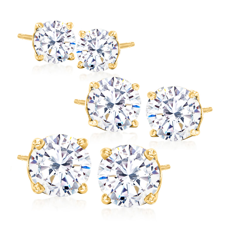 CZ stud earrings set with three pairs of round clear stones in gold-tone settings