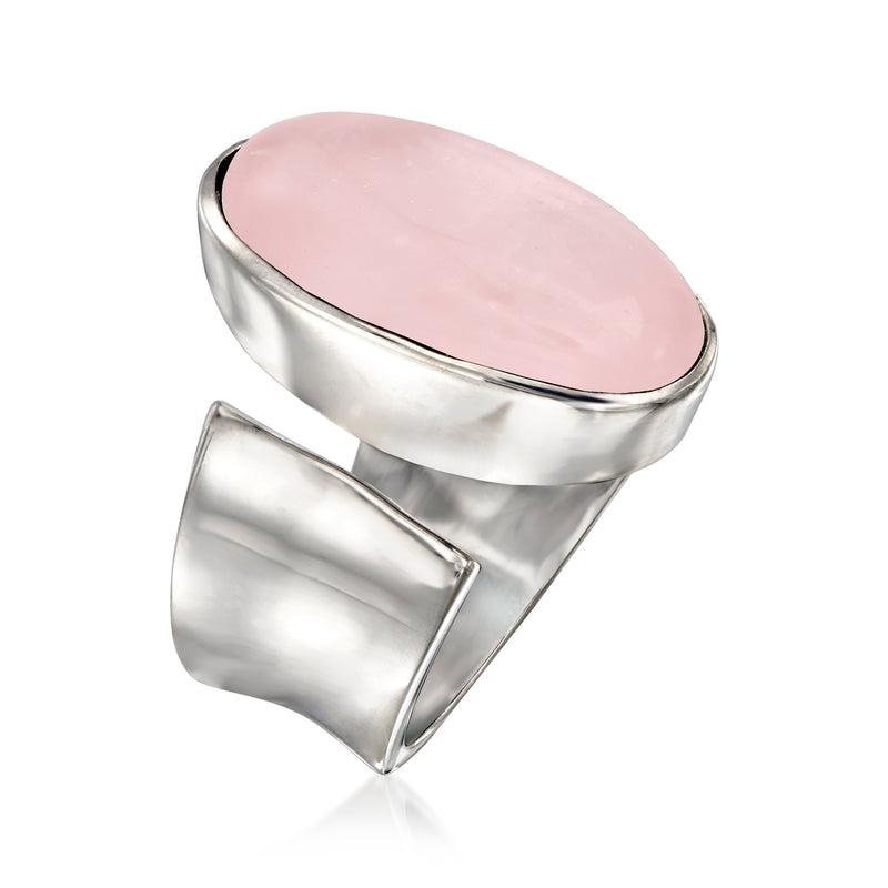 Sterling silver wrap ring with oval pale pink rose quartz in a smooth bezel frame.