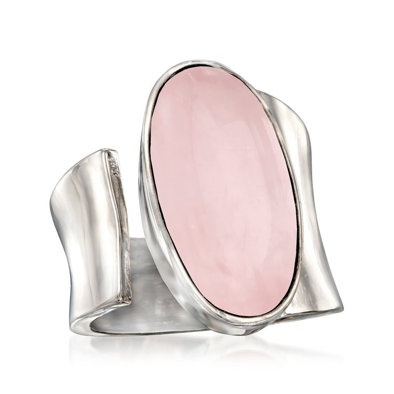 Sterling silver wrap ring with oval pale pink rose quartz gemstone and wraparound band.