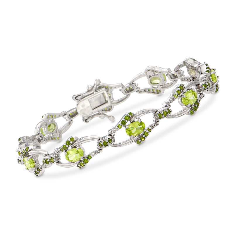 Sterling silver bracelet with oval green stones and small diamond accents, hinged clasp