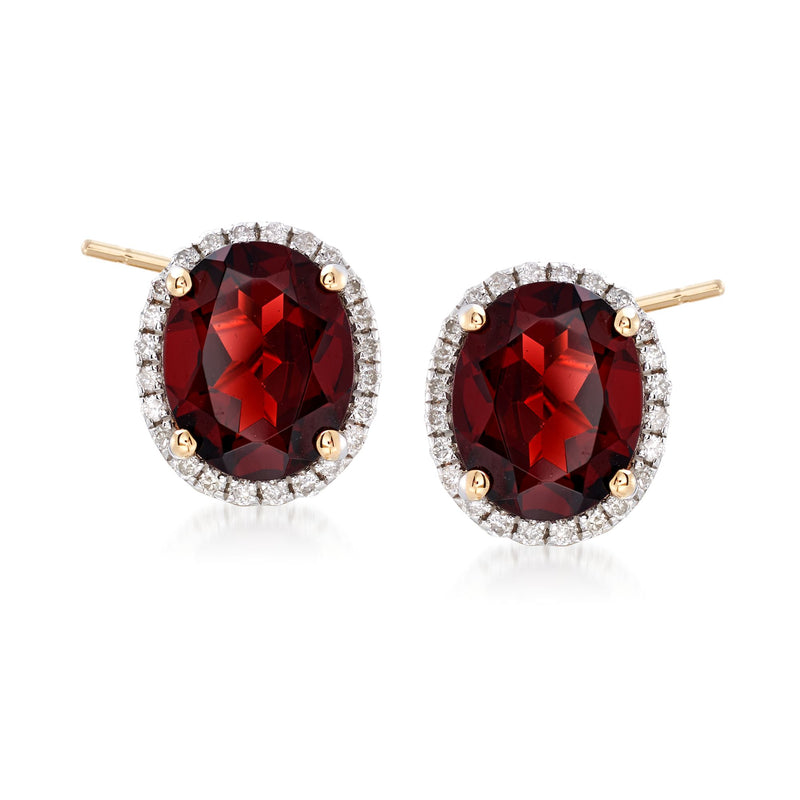 Oval garnet halo stud earrings in 14kt yellow gold with diamond accents