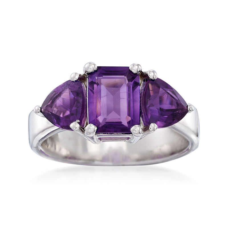 Sterling silver three-stone ring with square amethyst center and purple side stones