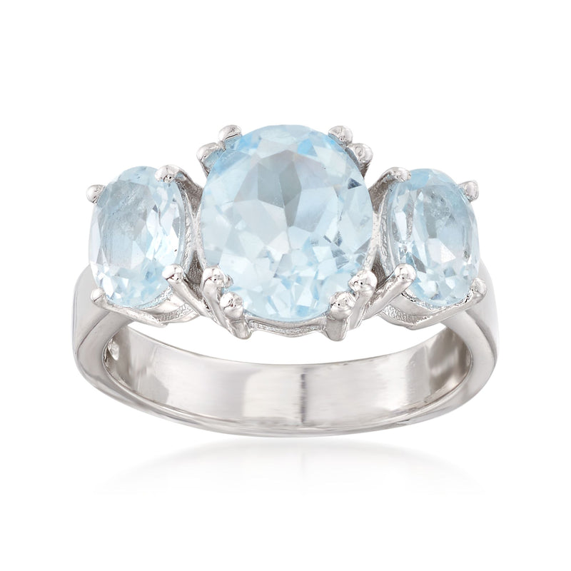 Sterling silver three-stone ring with sky blue topaz center and two side stones