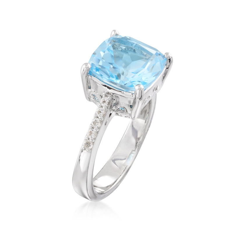 Sterling silver ring showing side prongs and halo of small clear stones