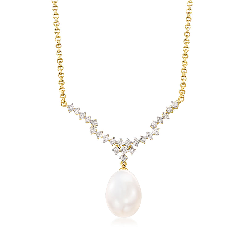 14kt yellow gold necklace with diamond stations and a large cultured pearl pendant