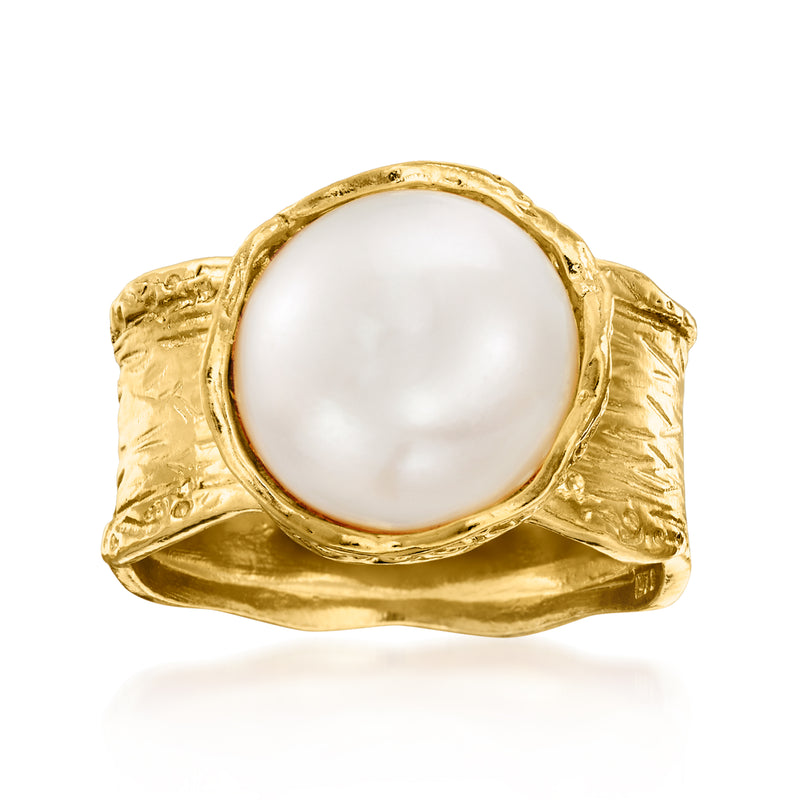 Gold-tone ring with large round white pearl set in textured bezel