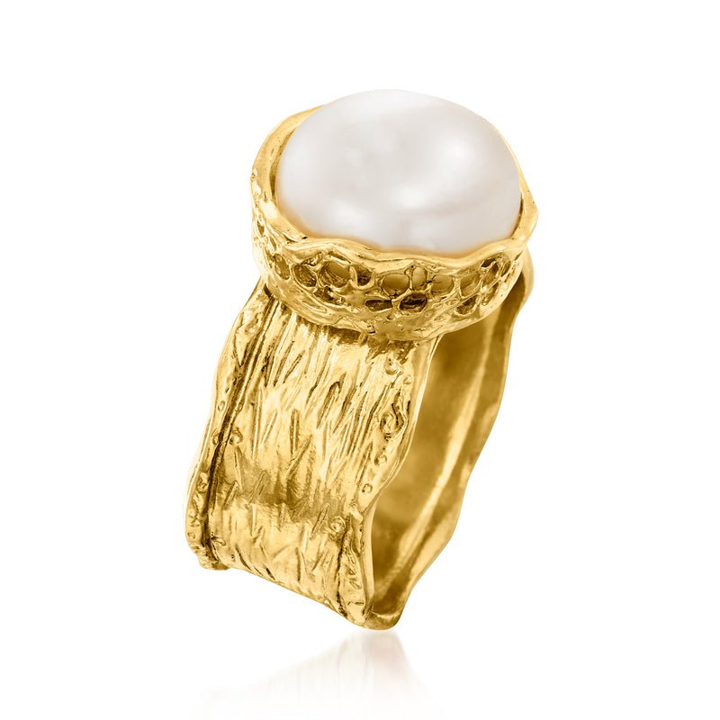 Gold-tone ring with round white pearl, sculpted band and open side profile