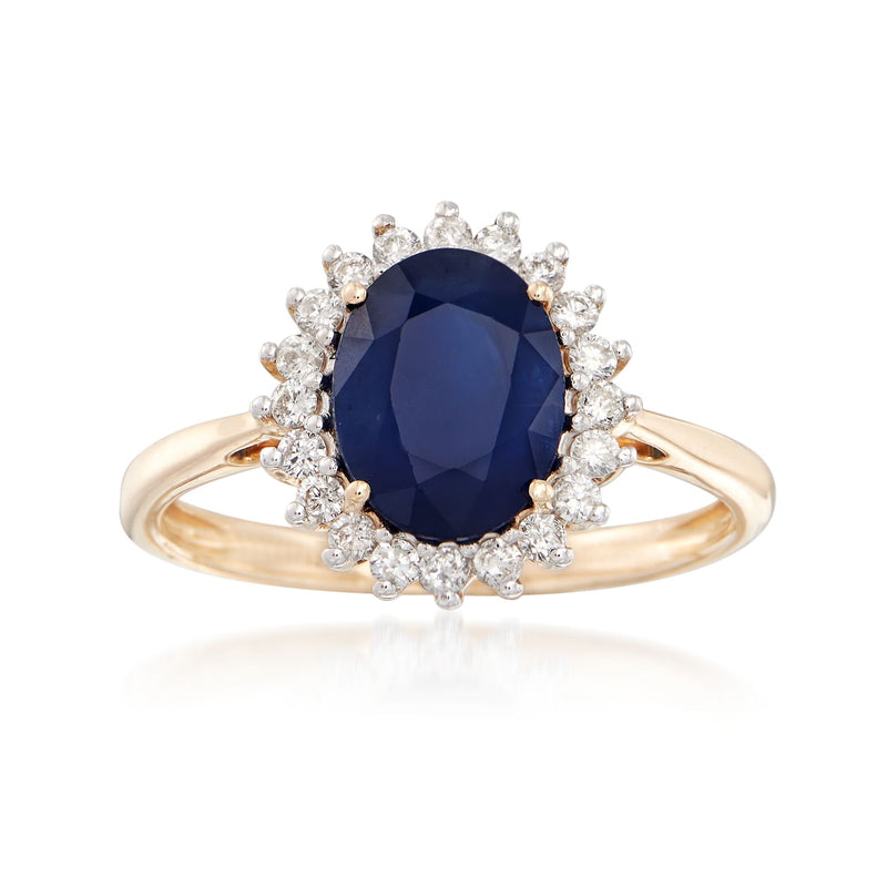 14kt yellow gold ring with oval dark blue sapphire and diamond halo