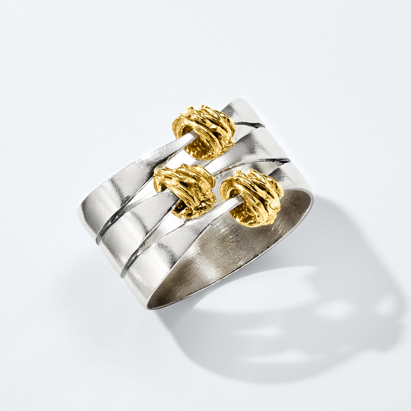 Two-tone sterling silver wrapped station ring with gold ridged segments