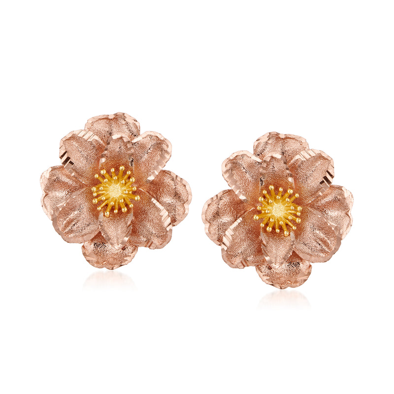 Two-tone gold flower stud earrings with textured petals and center sparkle