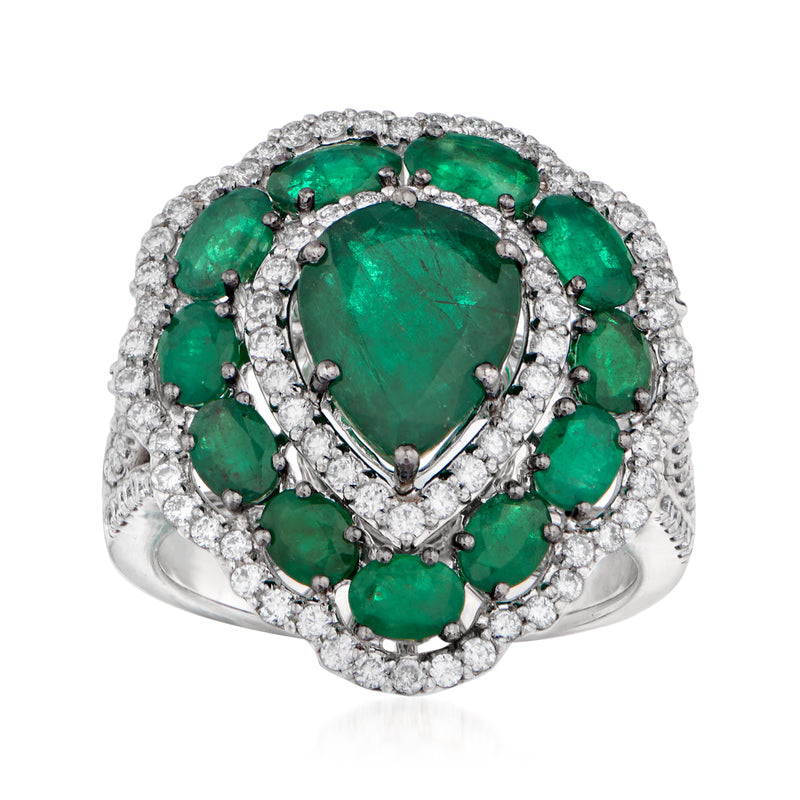 14kt white gold scallop ring with oval green emerald center and diamond halo