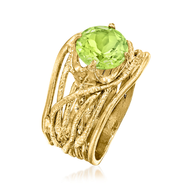 Gold over sterling ring with round peridot-green center stone and textured openwork band