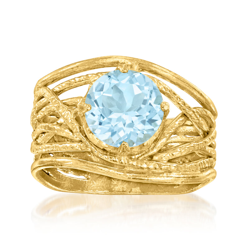 Gold-tone openwork ring with an oval sky-blue gemstone center