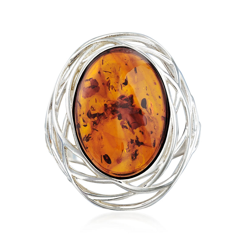 Sterling silver openwork ring with oval amber gemstone center