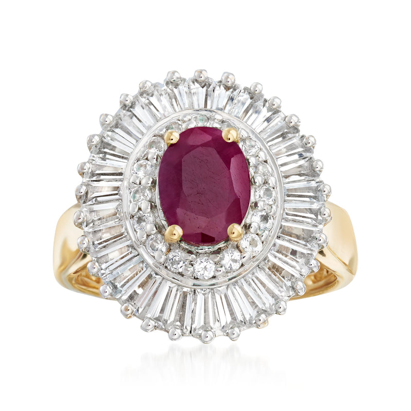 Oval red gemstone halo ring with clear stones and yellow gold band