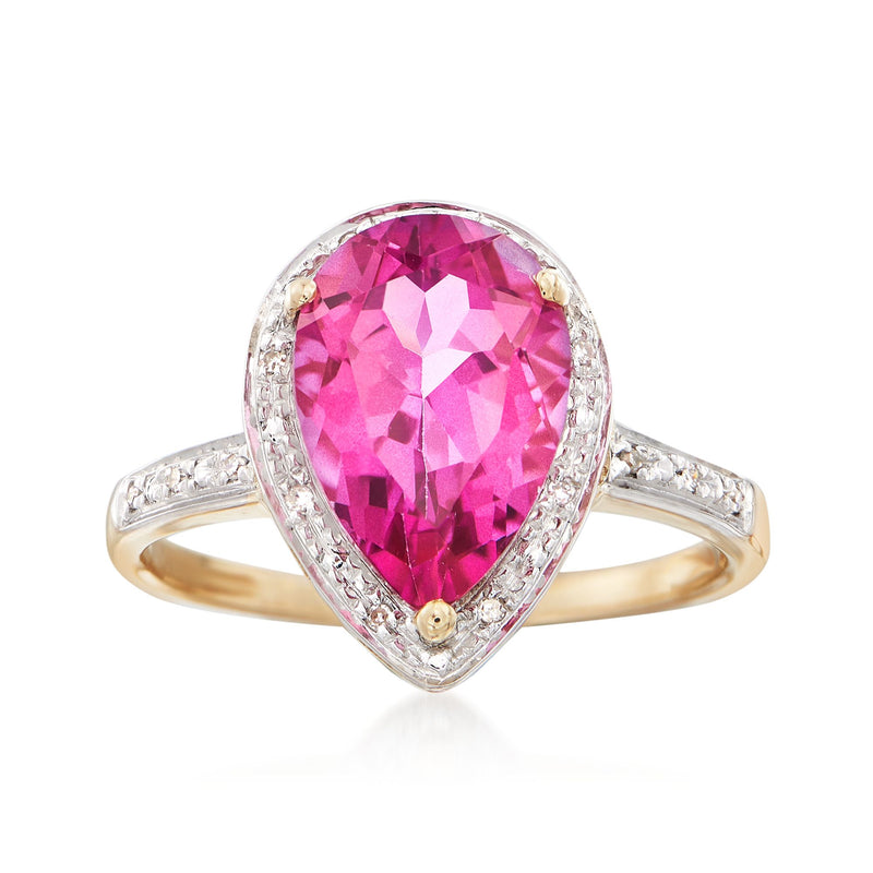 Oval pink topaz ring with diamond halo, split yellow gold shank