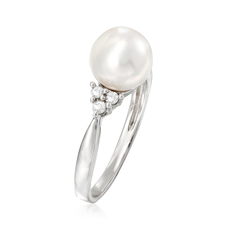Sterling silver ring with single white pearl and diamond cluster side setting