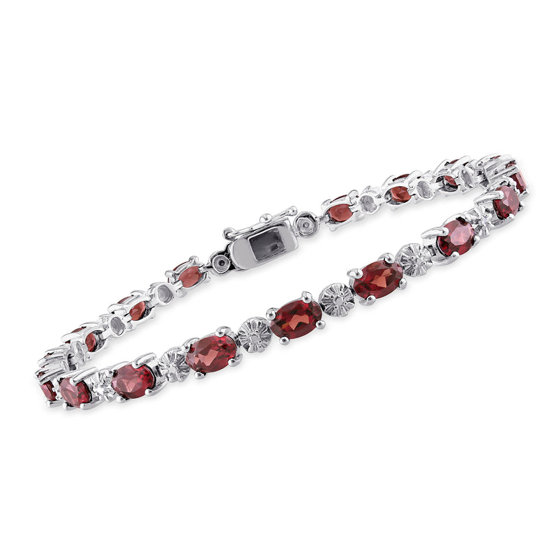 Sterling silver tennis bracelet with oval red garnets and small clear diamond accents