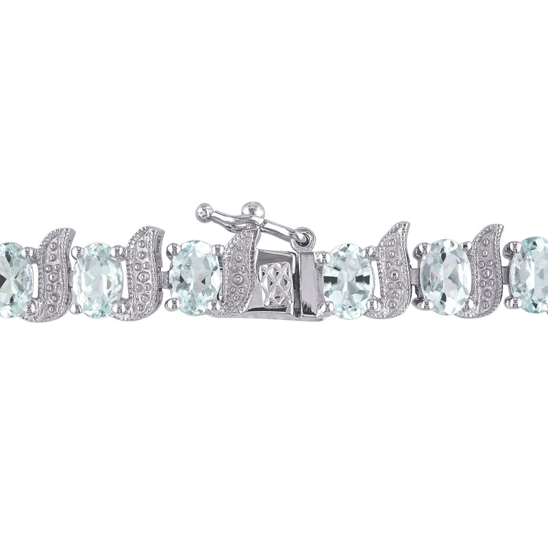 Sterling silver tennis bracelet with aquamarine stones and diamond-detail clasp