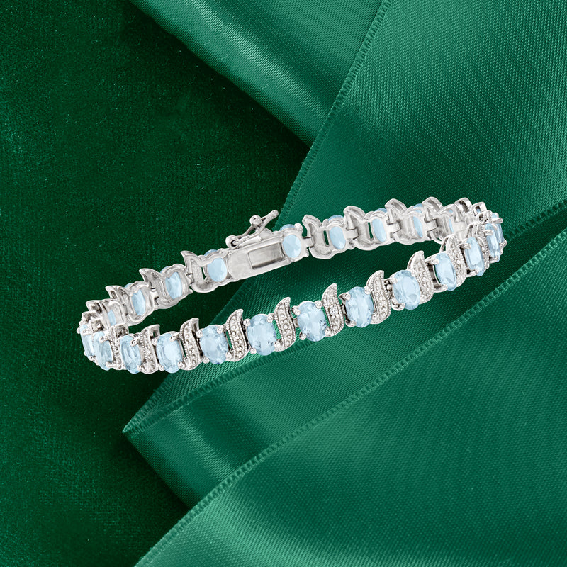 Sterling silver tennis bracelet with oval aquamarine stones and small diamond links