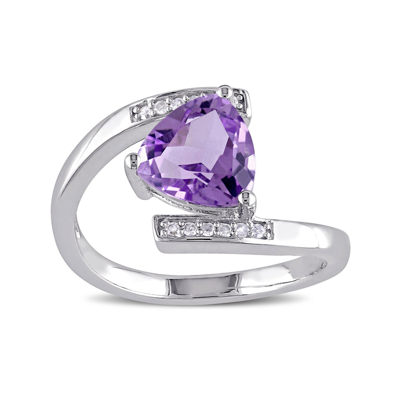 Sterling silver bypass ring with 1.40 ct amethyst center and small clear side stones