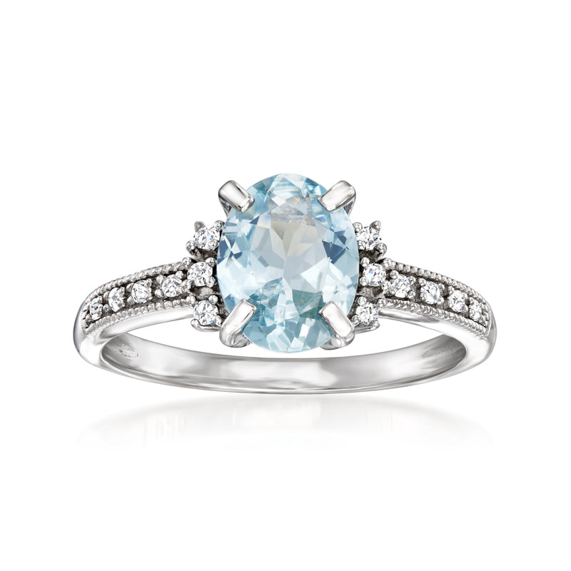 Sterling silver ring with oval aquamarine and diamond halo and side stones