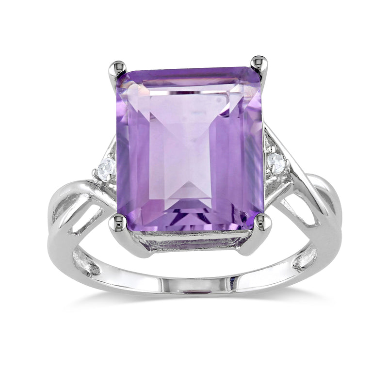 Sterling silver ring with large emerald-cut amethyst center and white gemstone side accents