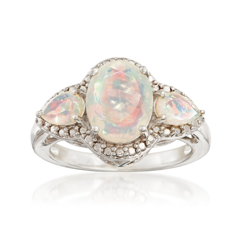 Sterling silver three-stone opal ring with oval center stone and round side stones