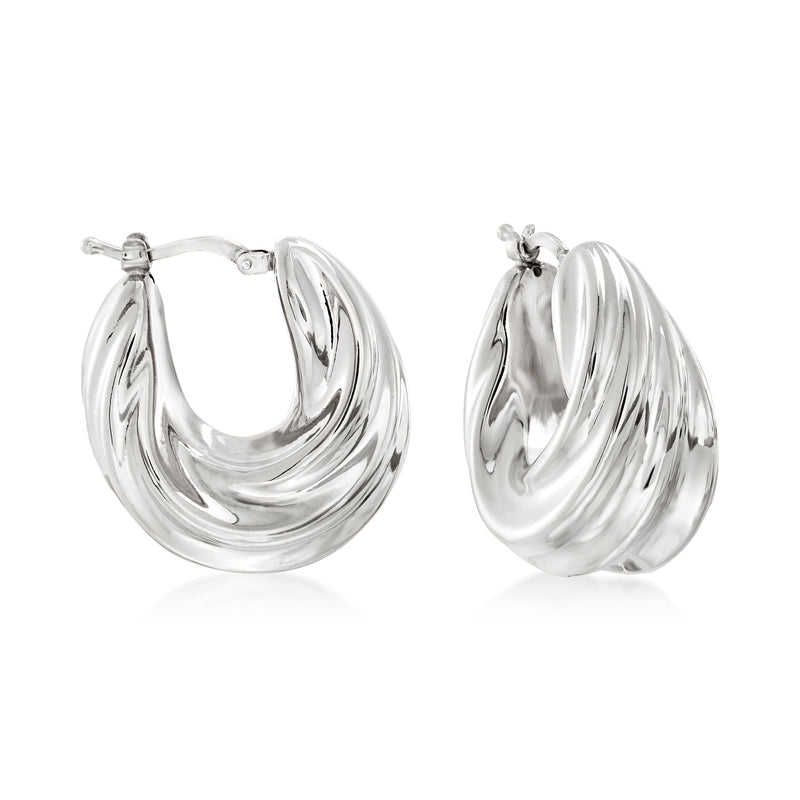 Twisted sterling silver hoop earrings with spiral ridges, hinged closure visible