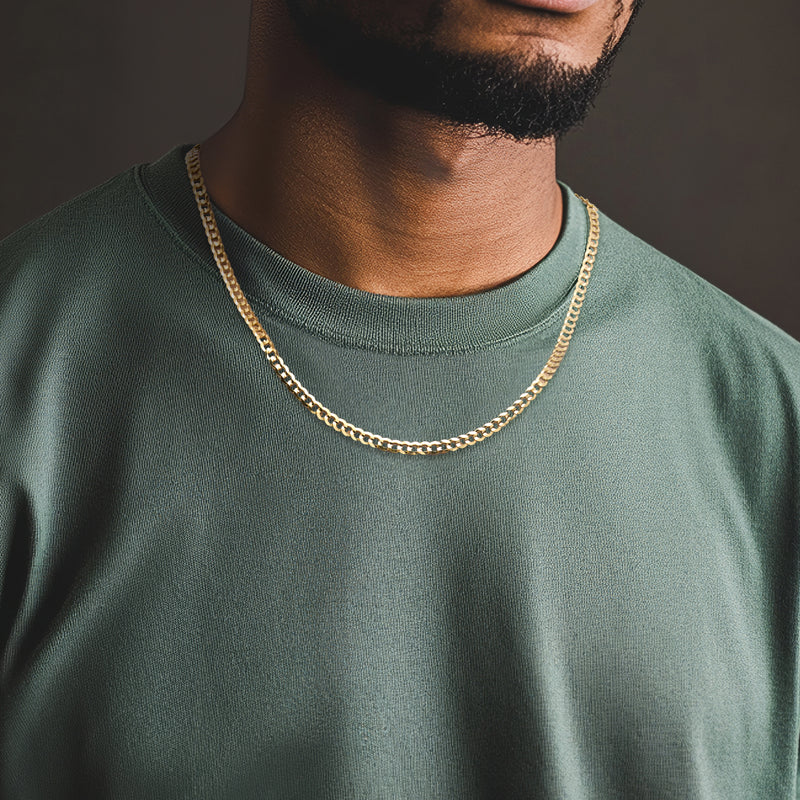 14kt yellow gold faceted curb-link necklace worn on men's neck