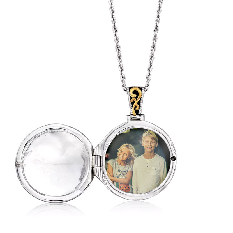 Open round locket necklace showing a two-person photo in the glass window