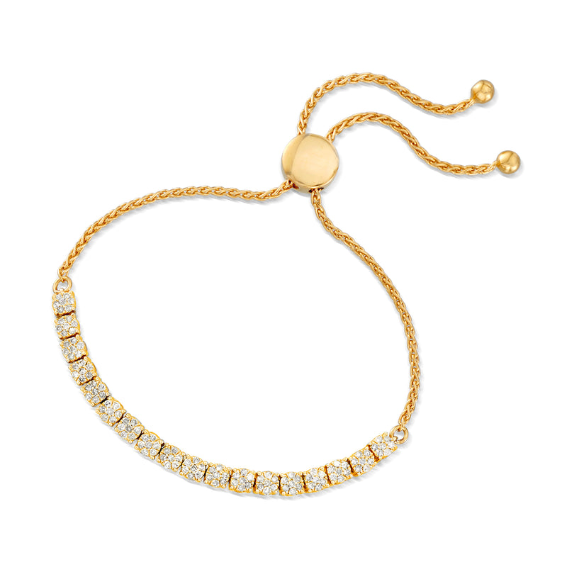 Gold bolo bracelet with continuous diamond-look row and round clasp discs.