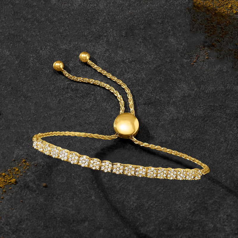 Gold diamond-look bolo bracelet with linked cord and oval cluster centerpiece.