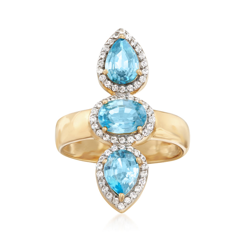 18kt gold over sterling ring with three pear-cut blue zircon and white halo accents