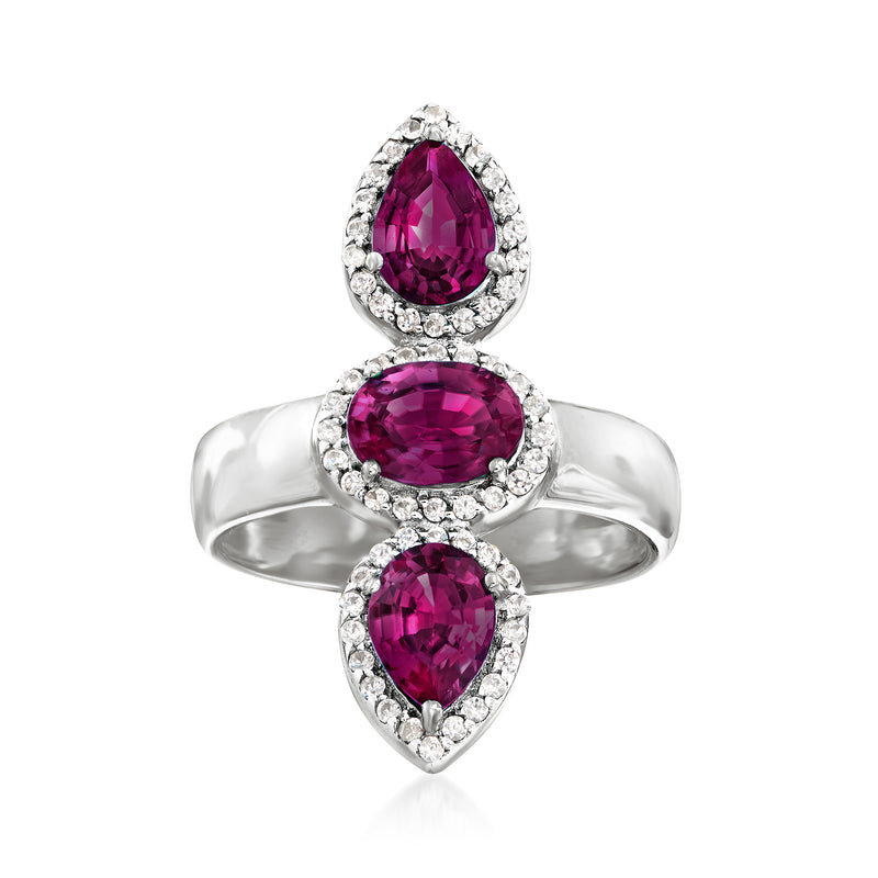 Sterling silver three-stone ring with purple rhodolite garnets and white zircon halos