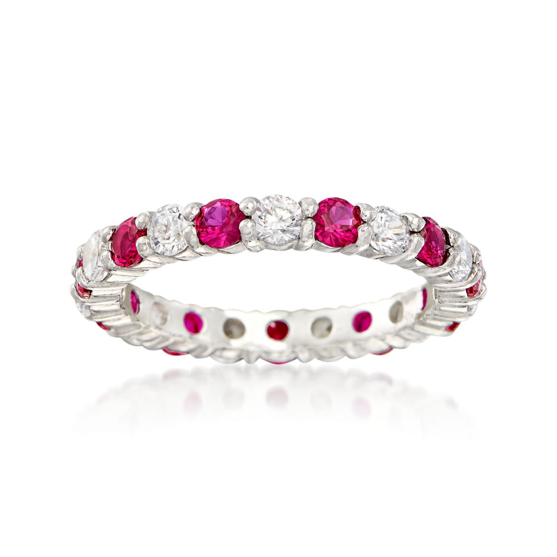 Sterling silver eternity band with pink simulated ruby and clear round stones