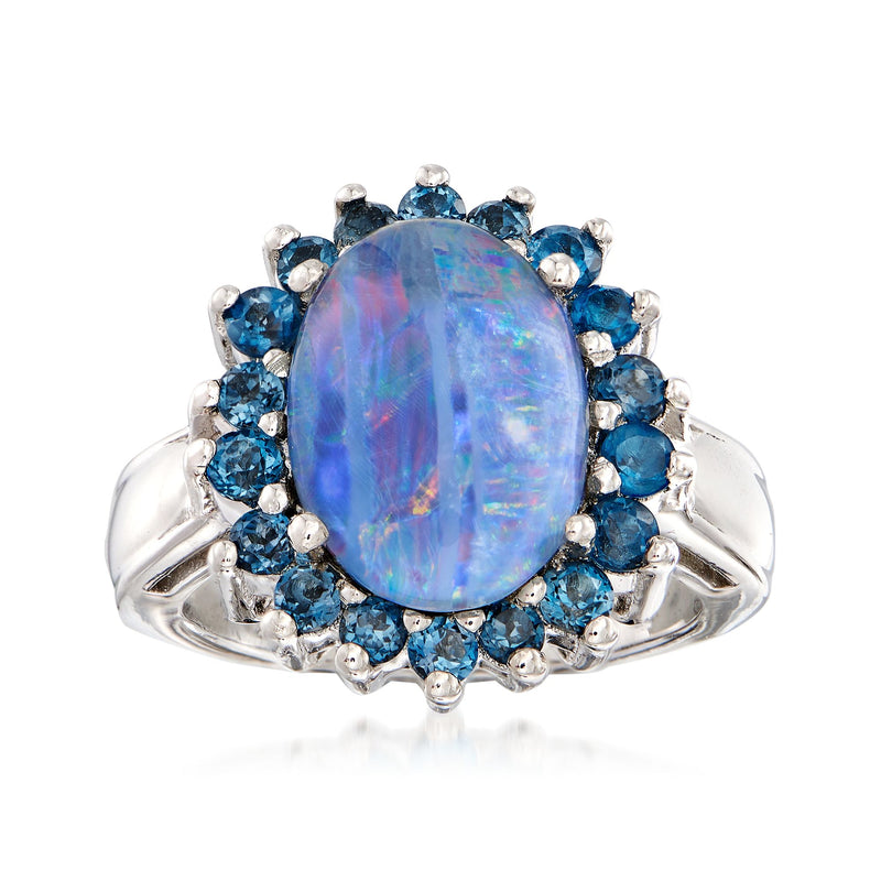 Sterling silver ring with oval opal center and London blue topaz halo in blue and clear
