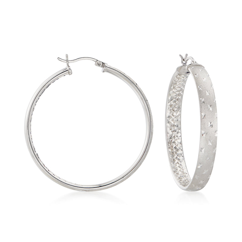 Sterling silver diamond-cut hoop earrings with textured surface