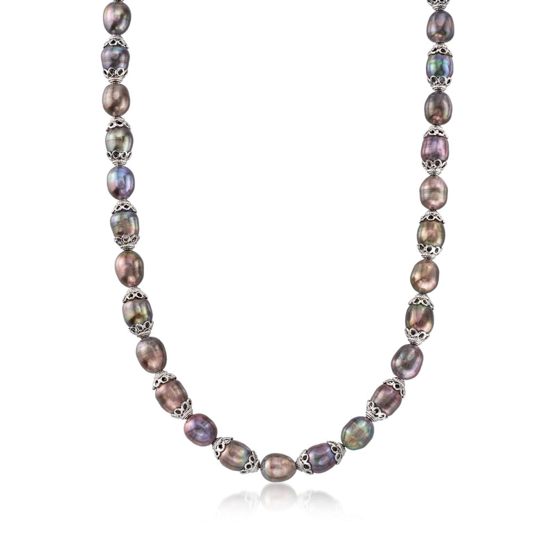 Black cultured pearl necklace with sterling silver bead stations, oval pearls in a strand