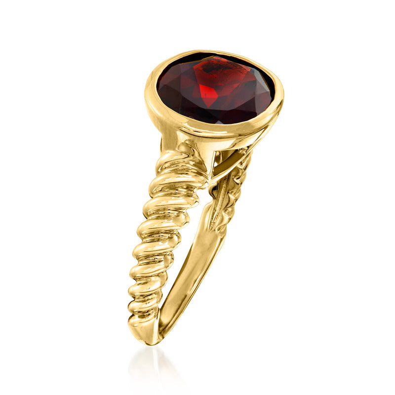 Oval garnet ring with dark red oval stone, gold-tone twisted shank