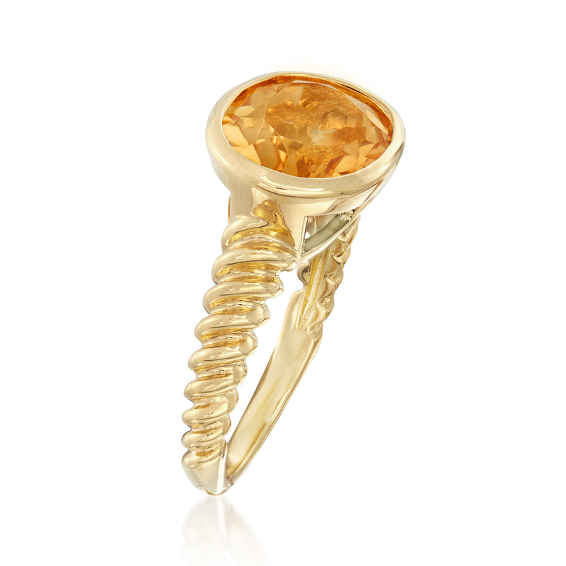 Gold over sterling ring with oval citrine bezel and twisted side band, side view