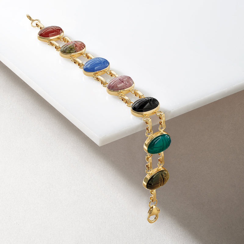 Yellow gold bracelet with multicolor oval stone charms and lobster clasp at end