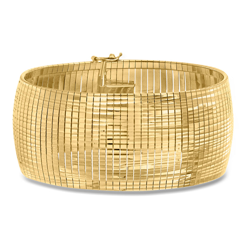 Gold omega bracelet with diamond-cut grid texture and polished finish, hinged clasp.