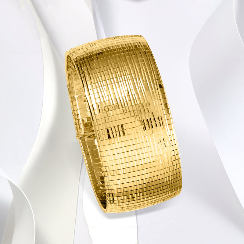 Gold omega bracelet with diamond-cut mesh grid and polished shine, side view cuff.