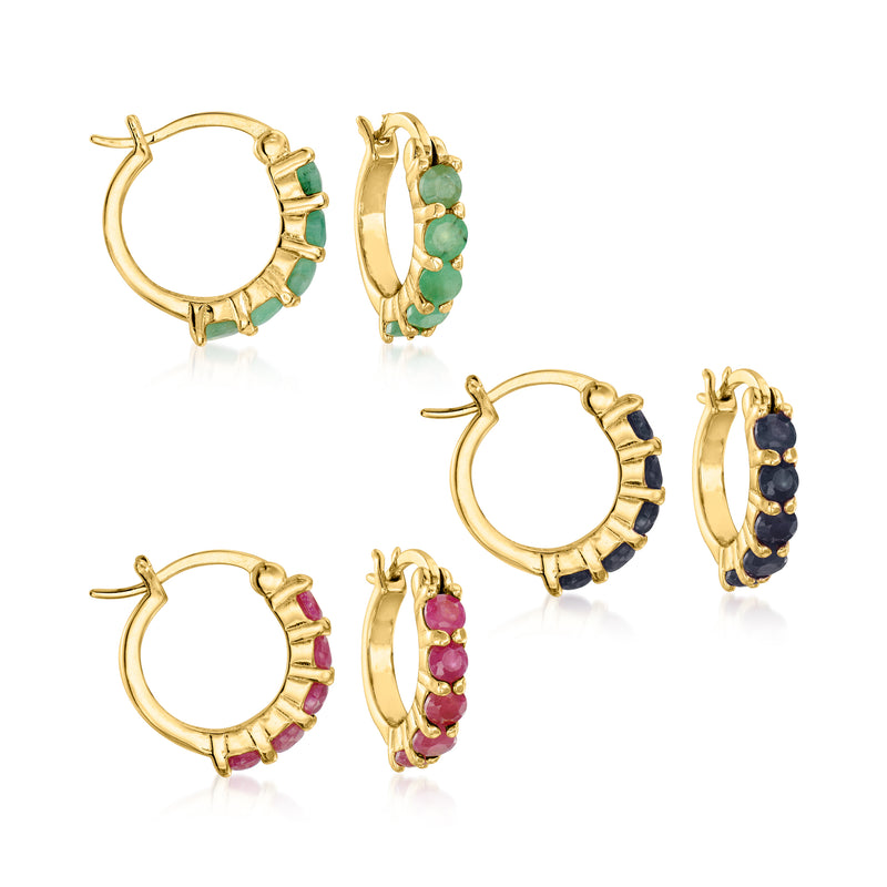 Set of huggie hoop earrings in gold tone with green, pink, and dark stones