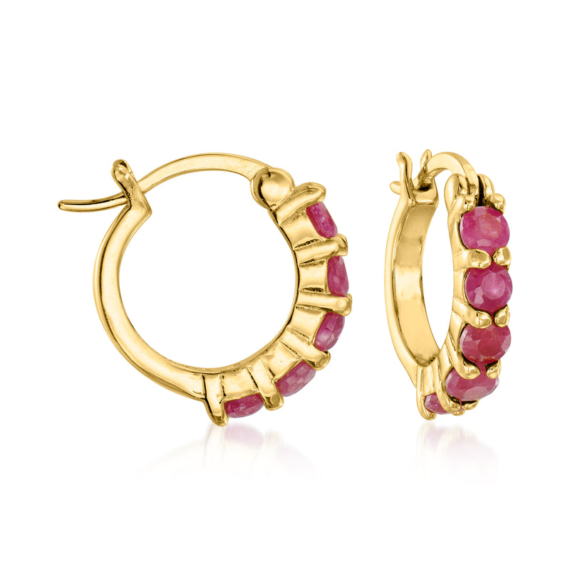Gold-tone huggie hoop earrings with round pink gemstone accents