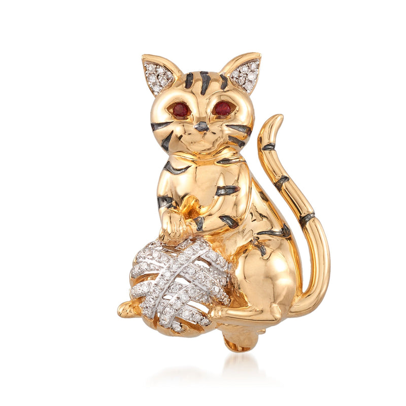 Gold cat pin with red garnet eyes and clear diamond-like stone detailing