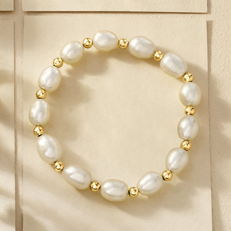 Cultured pearl stretch bracelet with oval pearls and 14kt yellow gold spacer beads